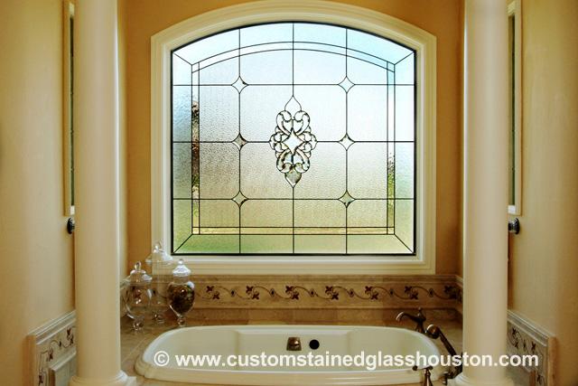 beautiful beveled glass window in the bathroom of a home in houston