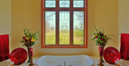 Vibrant stained glass bathroom interior with artistic privacy glass